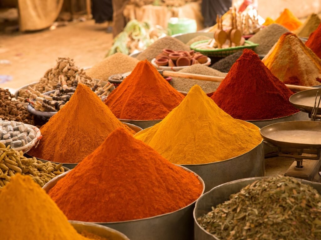 Mounds of turmeric, chilli and other ground spices