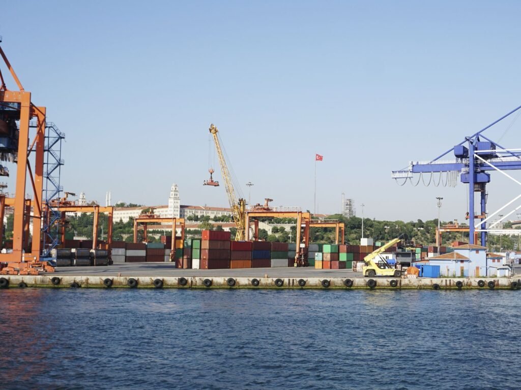 Cranes and containers along a container terminal quay