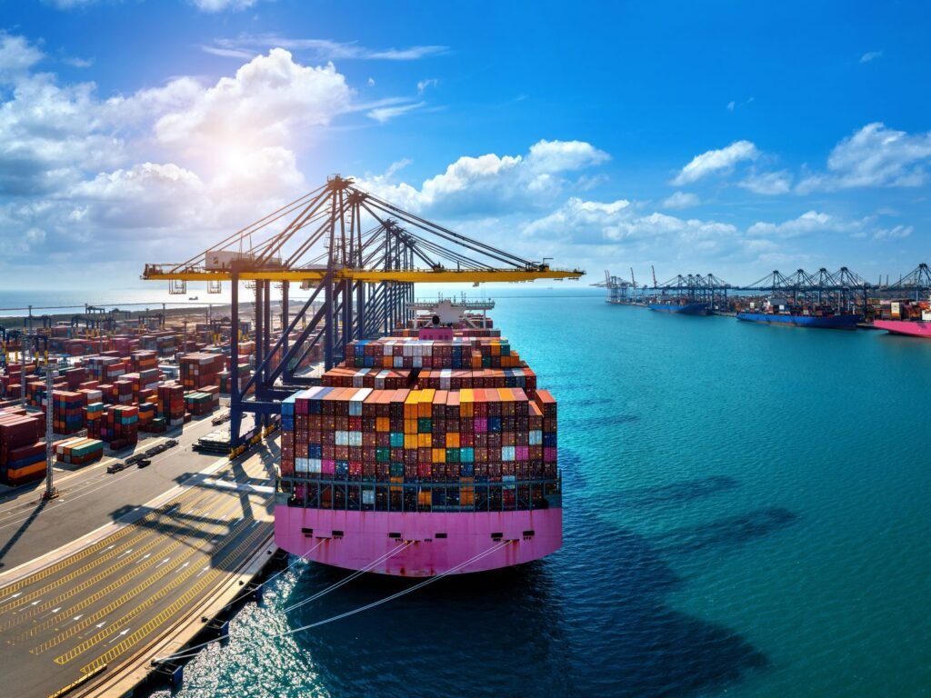 Aerial view of a loaded container ship alongside a port